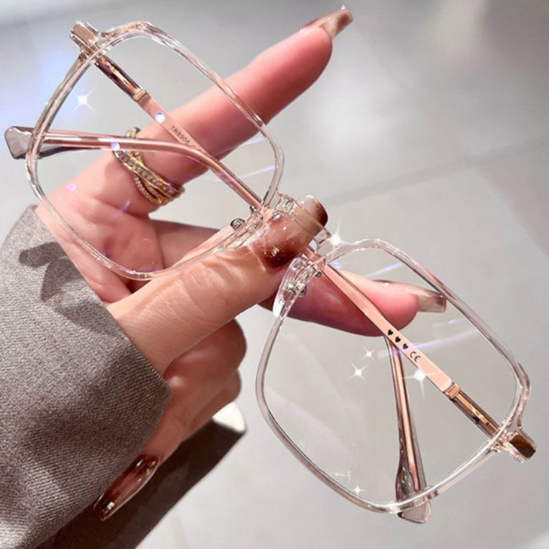 A Pair of Oversized, Slimming Flat Glasses with a Metal Frame, Square Lenses, Transparent Lenses, And a Stylish, Versatile Design.